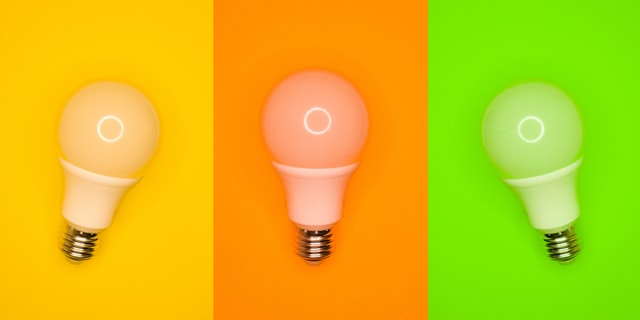 Seamless Access to Latest Product for Marketing lightbulbs on yellow orange green background